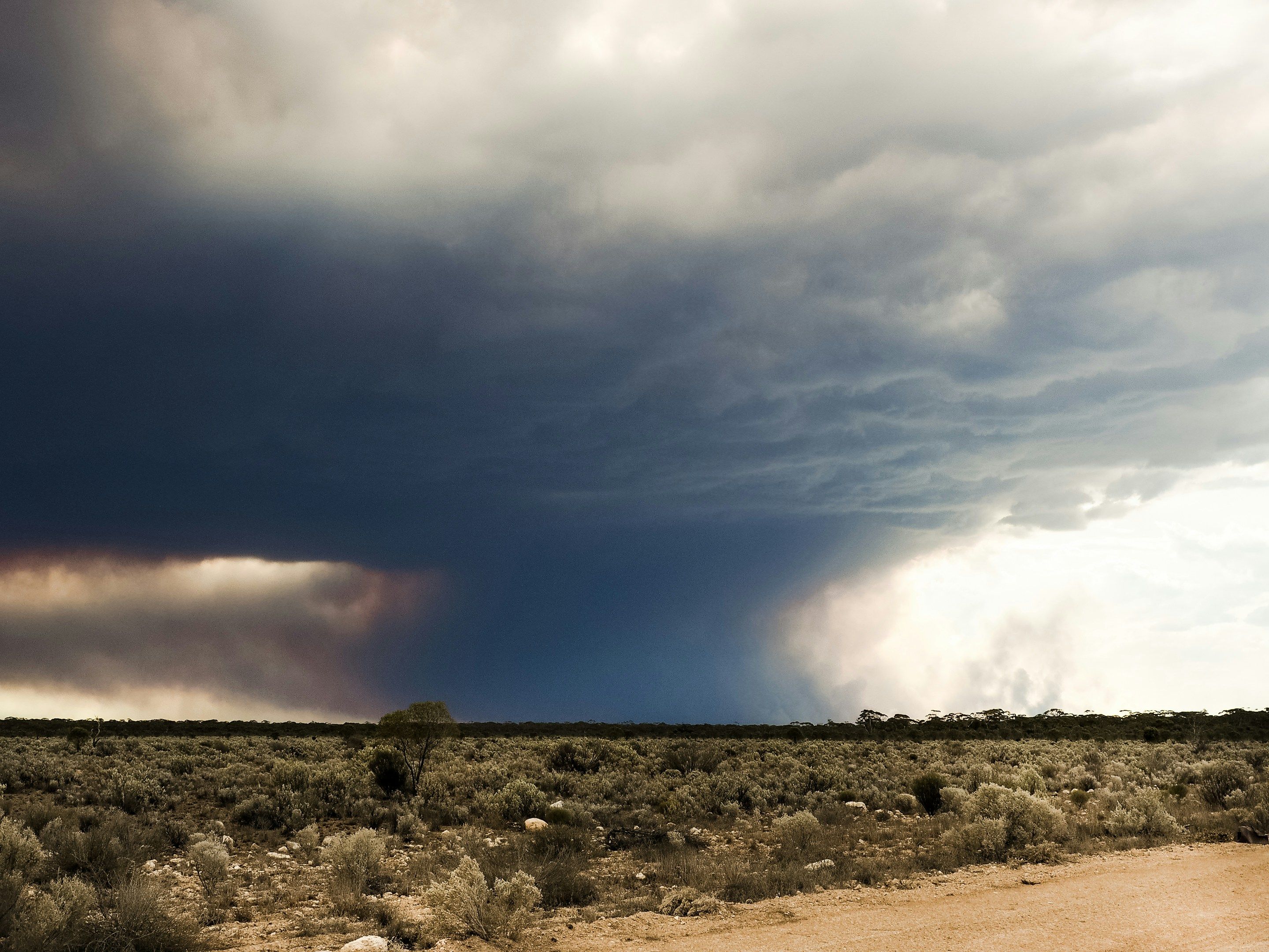 Fire storm clouds and over a remote rural area.