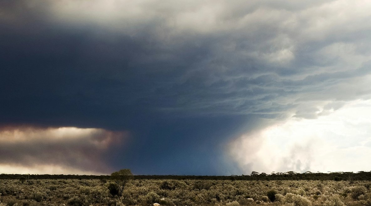 Fire storm clouds and over a remote rural area.